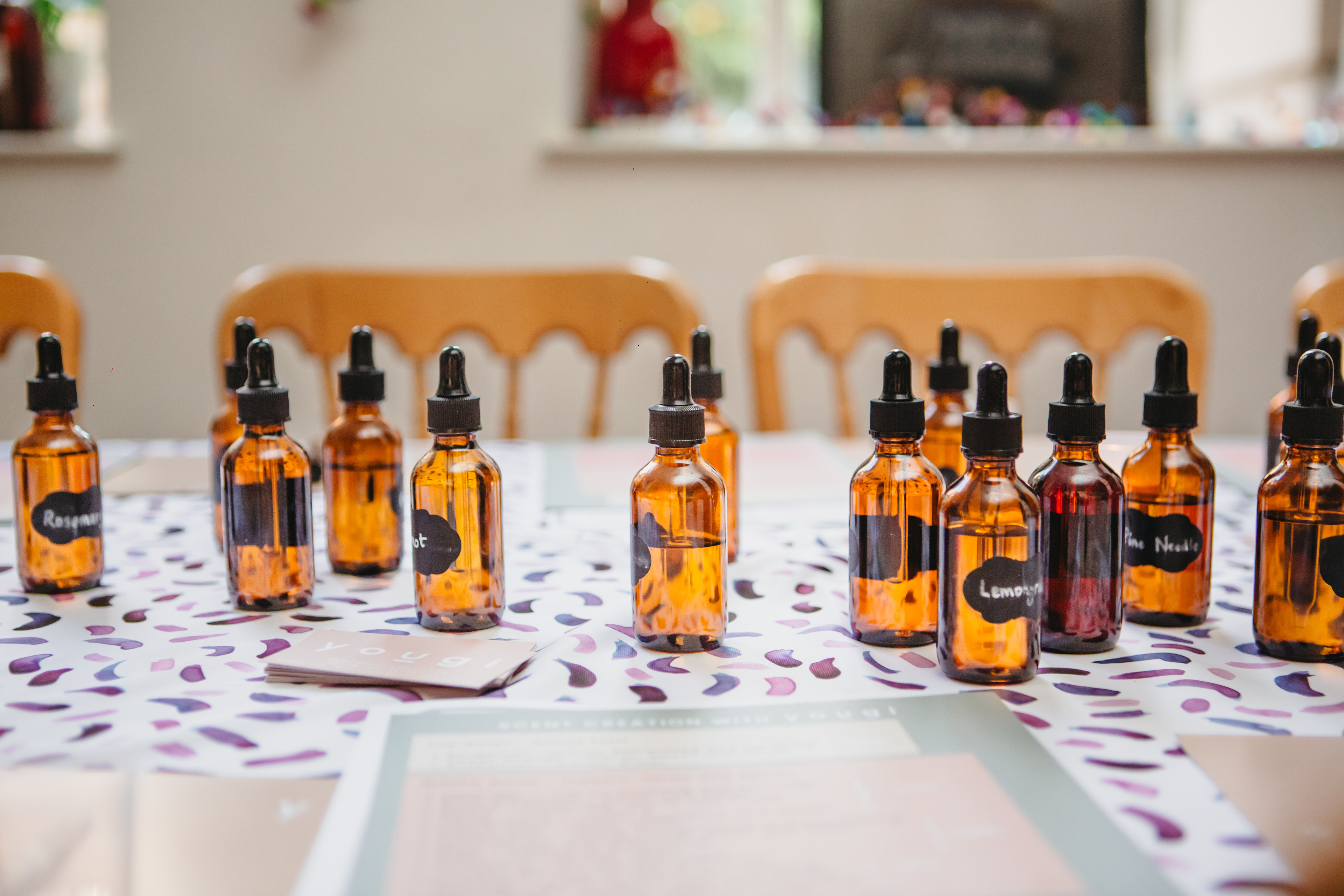 Amber dropper bottles filled with essential oils on a table 